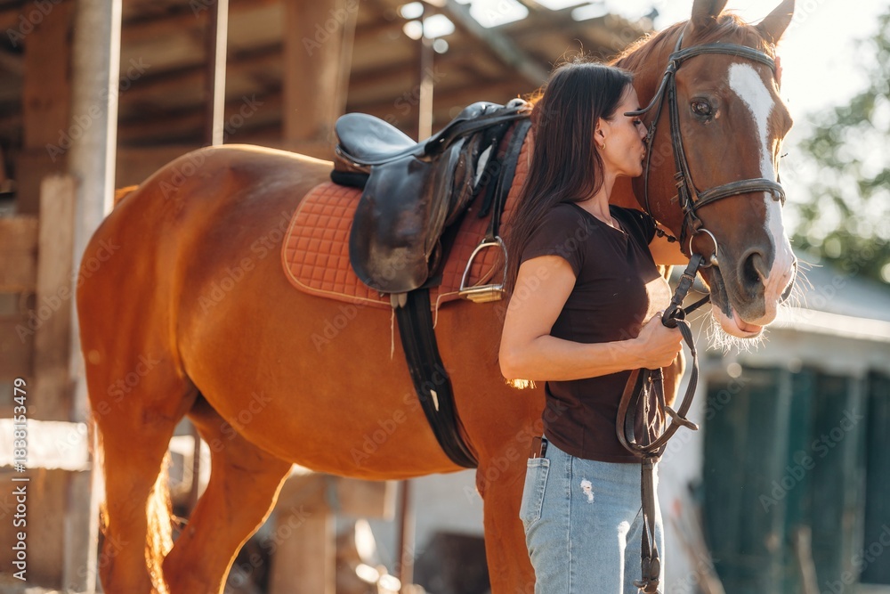 Obraz premium Non urban country scene. Woman is with horse on the farm