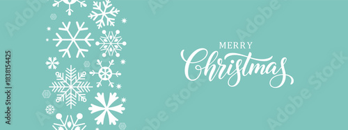 Elegant Merry Christmas greeting card with white snowflakes on  blue background, modern calligraphy text, festive winter holiday banner, minimalist horizontal layout, copy space for seasonal