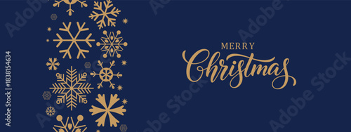 Elegant Merry Christmas greeting card with gold snowflakes on dark blue background, modern calligraphy text, festive winter holiday banner, minimalist horizontal layout, copy space for seasonal