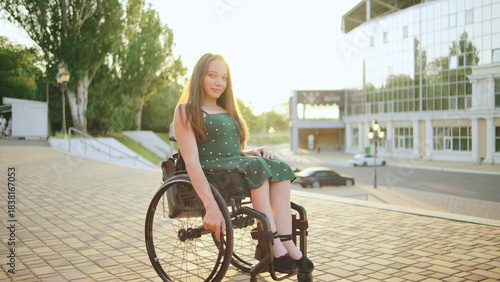 Inclusive Woman in wheelchair enjoy a sunny day outside a modern building while one woman uses a wheelchair to navigate the area with ease