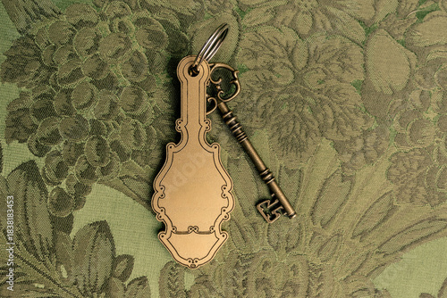 Принти на полотні Room key of a vintage-style hotel with a retro keychain, presented as a mockup