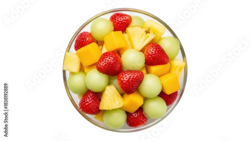 Isolated fruit salad in a glass bowl with strawberries, cantaloupe, mango, and pineapple
