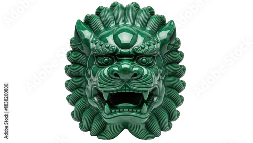 Isolated ornate green jade lion face carving, ferocious mouth, and intricate stone detail