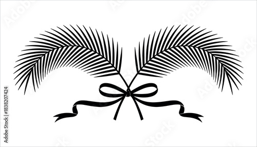Black palm fronds crossed and tied with a ribbon on a white background palm leaf tropical