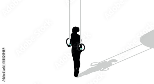 Silhouette of woman on gymnastic rings with shadow play
