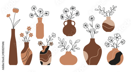 A stylish collection of modern ceramic vases in earthy brown tones containing simple line art flowers and leaves for minimalist boho home decor.