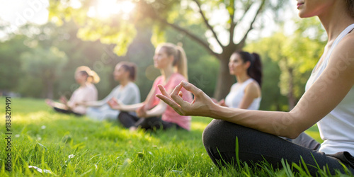 Background of mental states. Group of people practicing meditation or yoga in the park for relaxation and mindful therapy amidst nature in the morning