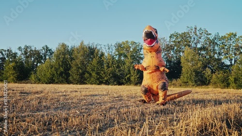 Inflatable Tyrannosaurus Dinosaur Dancing Happily In Open Sunny Field.meme Dance