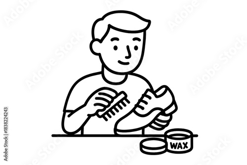 Man polishing leather dress shoe with brush and wax