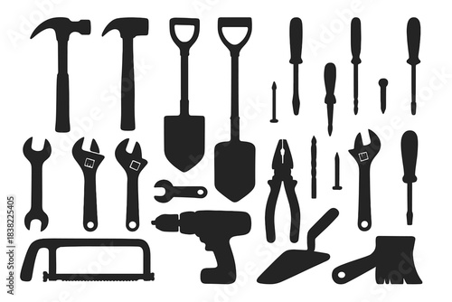 Silhouettes of hammers shovels wrenches screwdrivers and other essential work equipment