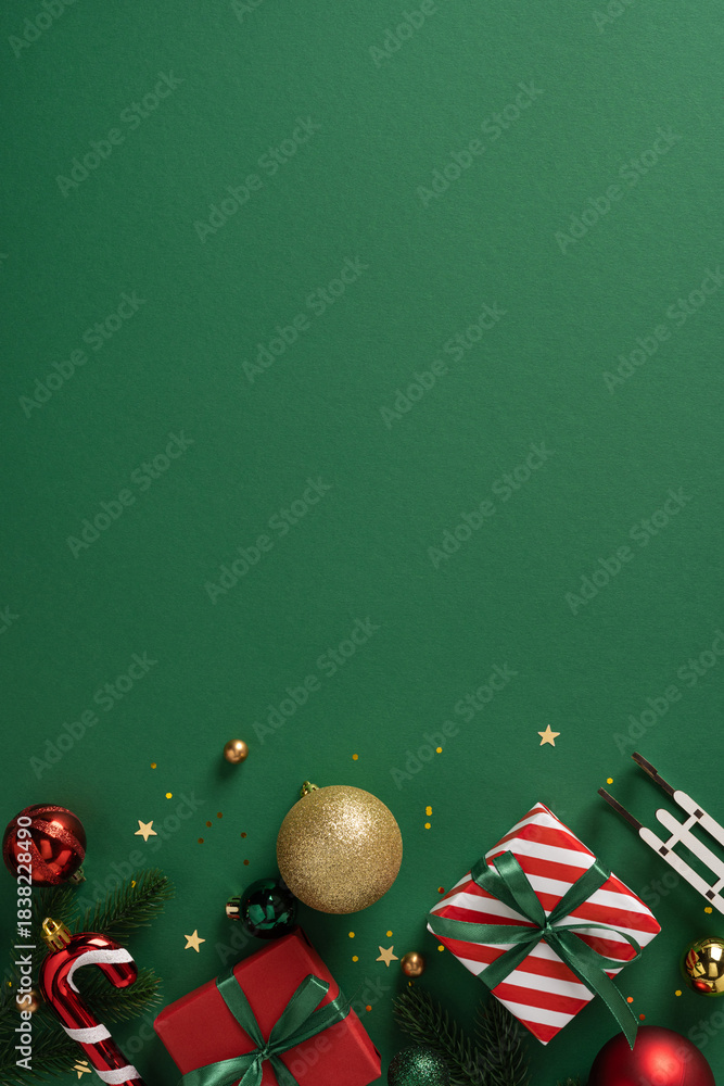 Naklejka premium Bright vertical holiday scene featuring wrapped gifts, ribbons, baubles and festive decor on a green background, ideal for Christmas and New Year celebrations and seasonal branding