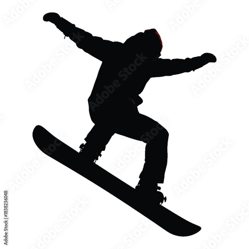 Silhouette of a snowboarder in mid air performing a trick