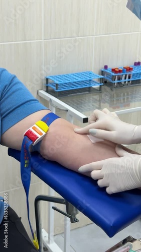 Doctor draws the patient's blood for examination. Close Up of doctor's hand holds a syringe and a vaccine bottle at the hospital. Disease Prevention Immunization. Health and medical concepts.