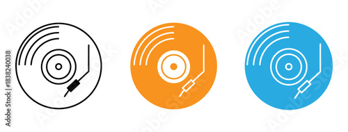 Three vinyl records in black orange and blue