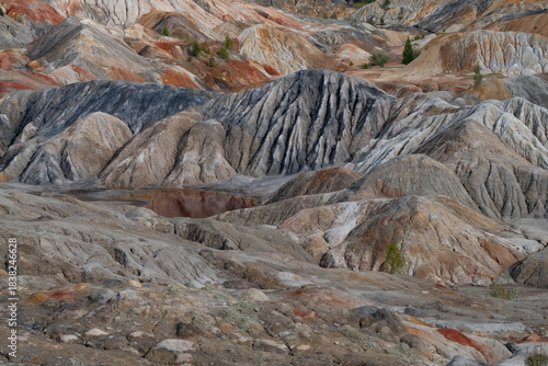Fotografie Colorful landscape of abandoned refractory clay quarry (Ural Mars) on an August day