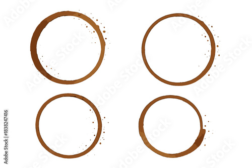 Four brown coffee cup rings and stains isolated on a clean white background