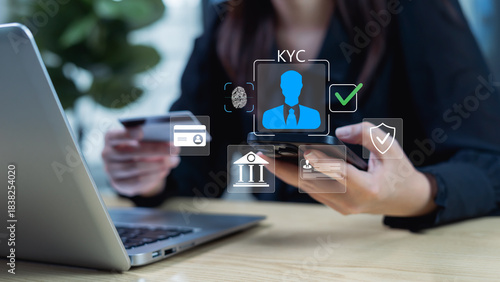 Canvas Print Businesswoman using an interactive digital KYC interface performs E-KYC verification and ensures compliance with security requirements for using banking apps and credit card usage for shopping
