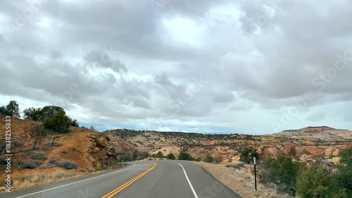 POV road trip through Utah and Arizona along Route 12 and Highway 95, with scenic canyons, mesas, red rocks and desert landscapes. Horizontal and vertical footage.