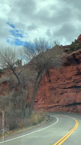POV road trip through Utah and Arizona along Route 12 and Highway 95, with scenic canyons, mesas, red rocks and desert landscapes. Horizontal and vertical footage.