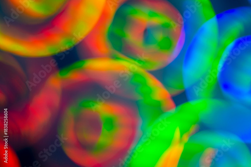 Wallpaper Mural Soft blurred circles of red, green, blue and yellow light overlap on a dark background, creating an abstract composition of glowing gradients, gentle motion blur and layered color harmony Torontodigital.ca