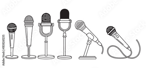 Set of various black and white standing microphones on stands for audio recording