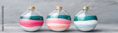 Hand painted christmas ornament ball decoration with gold cap on gray background festive colorful holiday