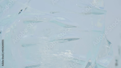 A close-up of the purest frozen ice, completely transparent. Ice structure and global warming