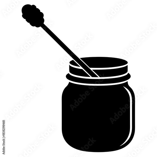 jar of honey and spoon