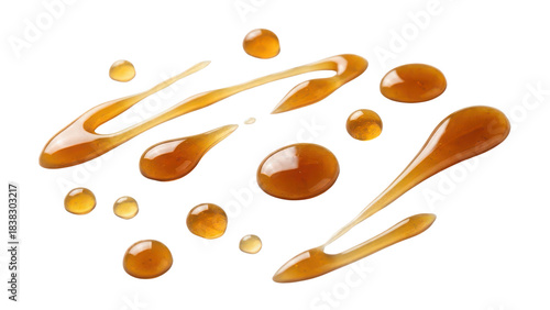 Golden Amber Viscous Liquid Drops and Drizzles Isolated on White Background