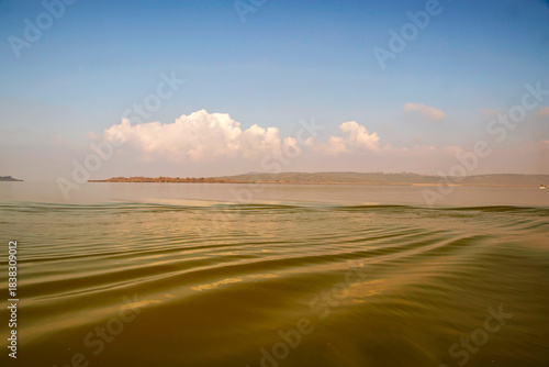 Fototapeta Naklejka Na Ścianę i Meble -  colors on the wavy lake water and blue sky, Uluabat lake Bursa 
