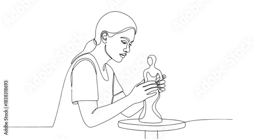 Female sculptor shaping clay figure with focus and concentration  