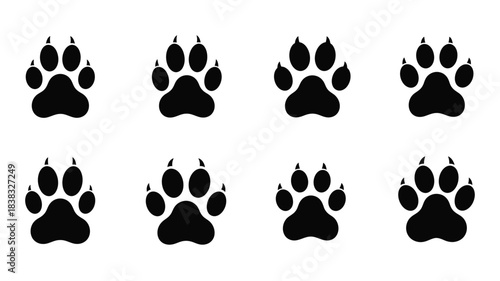 A simple arrangement of black paw prints on a white background