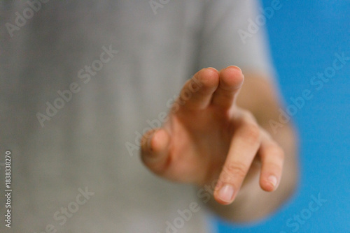 Close-up of a hand reaching...