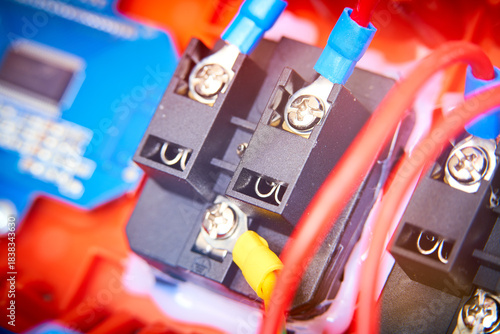Close-up of electronic circuit board with fiber optic cables and connectors