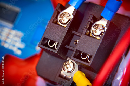Close-up of electronic circuit board with fiber optic cables and connectors