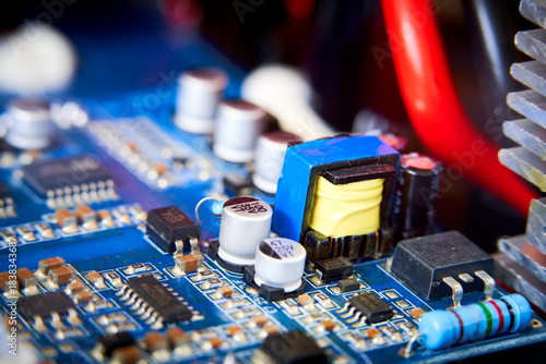 Close-up of electronic circuit board with electronic components. Technology background