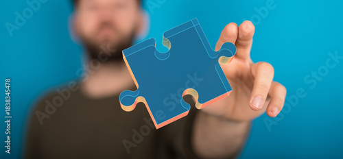 A person holding a blue puz...