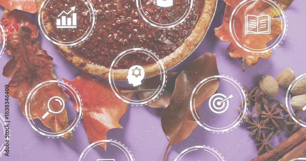 Obraz premium Displaying round tart with nut topping among autumn leaves, spices on lavender backdrop, UI icons