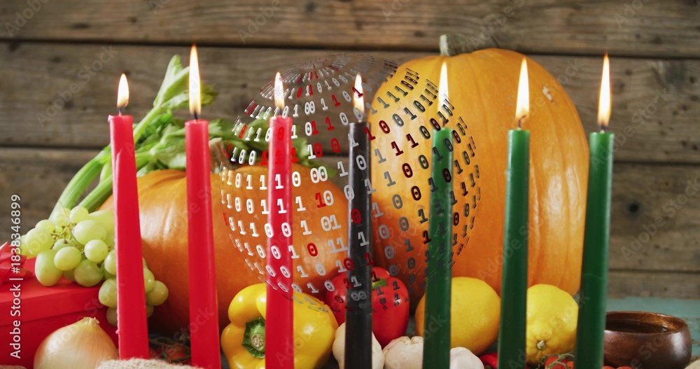 Fototapeta premium Displaying pumpkin center glowing on teal cloth on wooden table, with lit candles and binary sphere