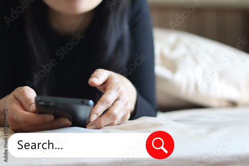 Close up woman hand hold using smart phone with search bar icon 