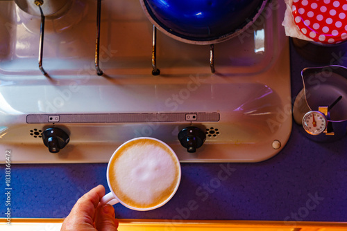 Caravan inside, preparing coffee in kitchen area