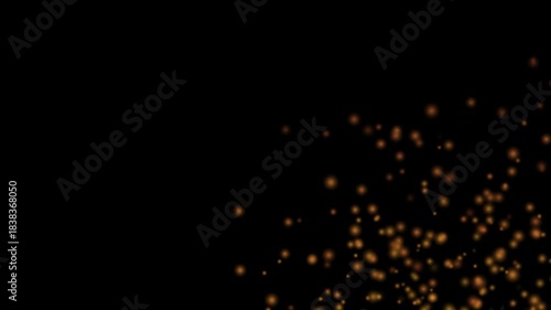 light particles floating upwards on a black background