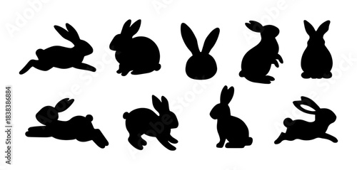 Easter bunny silhouettes. Silhouettes set of rabbits in different poses. Traditional holiday symbol. Vector illustration