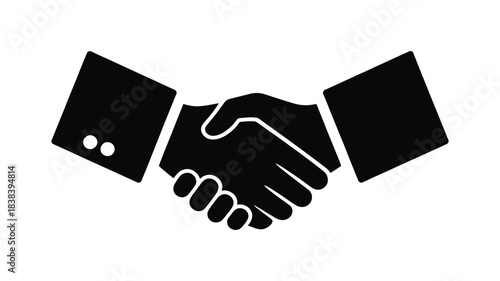 Two hands shaking in a business handshake symbol representing agreement and partnership