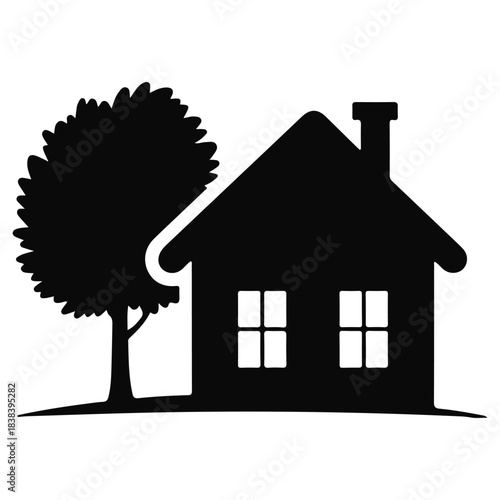 Black silhouette of a house with a tree