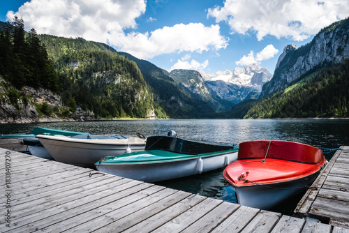 Colorful Boats Docked at Gosausee Lake with Alpine Mountains