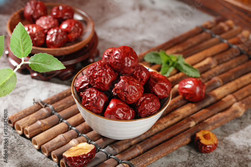 Xinjiang Dried Jujube Dates in Bowls on Bamboo Mat - Traditional Chinese Superfood