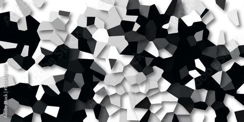 Dynamic abstract mosaic of fractured geometric shapes in monochrome with subtle shadows and highlights creating a textured 3D effect for modern design