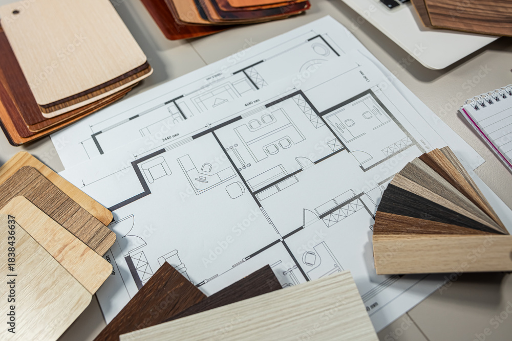 Fototapeta premium Interior design color palette with house floor plan and wood texture samples on desk