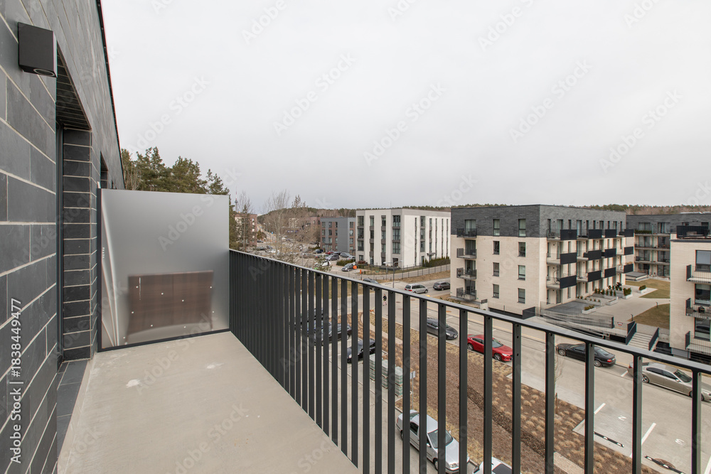 Fototapeta premium Modern Balcony Architecture Overlooking Residential Neighborhood in Urban Environment